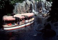 A boat floats along the river on the Jungle Cruise ride at the Magic Kingdom.